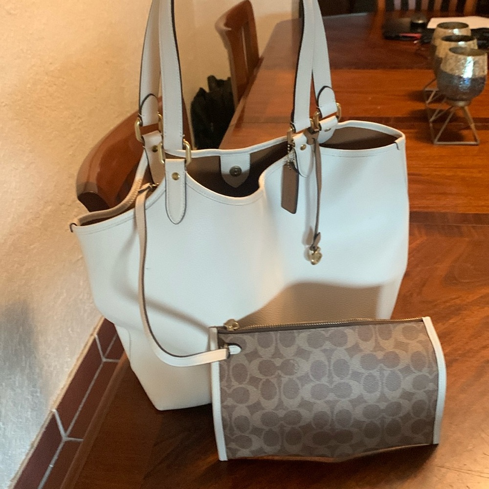 Brand new white large Coach handbag with dust bag. Used 1 x coach makeup bag.